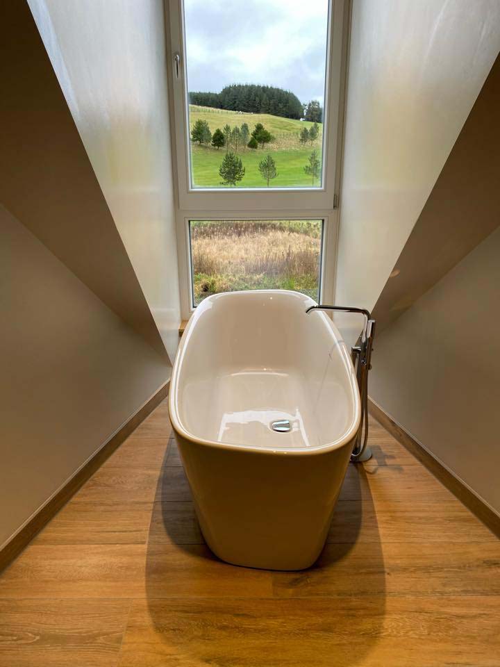 Freestanding bath fitted in a country bathroom