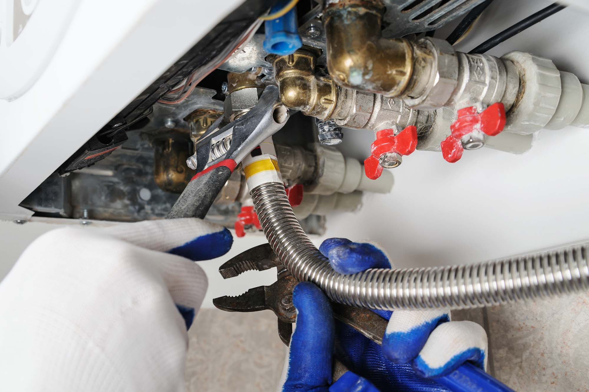 Gas Safe engineer servicing a Vaillant boiler